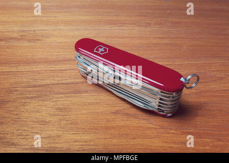 Victorinox SwissChamp pocket knife, 33 tools, on wooden background Stock Photo