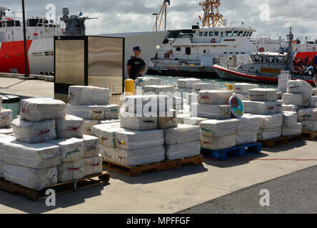 The Coast Guard offloaded Feb. 27, 2017 approximately 4.2 tons of seized cocaine, worth an estimated $125 million in wholesale value, at Coast Guard Sector San Juan. The crew of the Coast Guard Cutter Joseph Napier seized the contraband and apprehended four Guyanese smugglers following the interdiction of the 70-foot fishing vessel, Lady Michelle, in international waters north of Paramaribo, Suriname Feb. 16, 2017. (DEA courtesy photo) Stock Photo