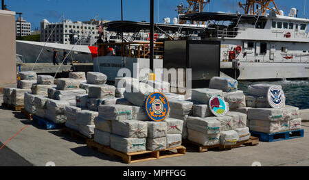 The Coast Guard offloaded Feb. 27, 2017 approximately 4.2 tons of seized cocaine, worth an estimated $125 million in wholesale value, at Coast Guard Sector San Juan. The crew of the Coast Guard Cutter Joseph Napier seized the contraband and apprehended four Guyanese smugglers following the interdiction of the 70-foot fishing vessel, Lady Michelle, in international waters north of Paramaribo, Suriname Feb. 16, 2017. (DEA Courtesy photo) Stock Photo