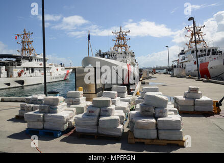 The Coast Guard offloaded Feb. 27, 2017 approximately 4.2 tons of seized cocaine, worth an estimated $125 million in wholesale value, at Coast Guard Sector San Juan. The crew of the Coast Guard Cutter Joseph Napier seized the contraband and apprehended four Guyanese smugglers following the interdiction of the 70-foot fishing vessel, Lady Michelle, in international waters north of Paramaribo, Suriname Feb. 16, 2017. Stock Photo