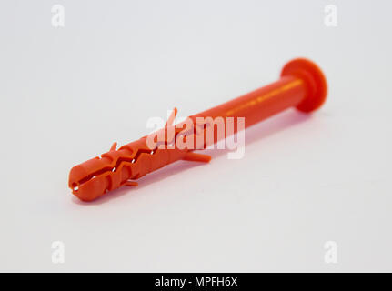 One plastic orange dowel on white background Stock Photo