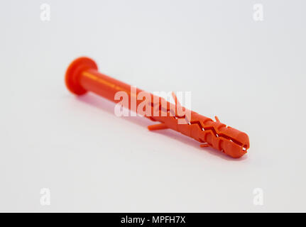 One plastic orange dowel on white background Stock Photo