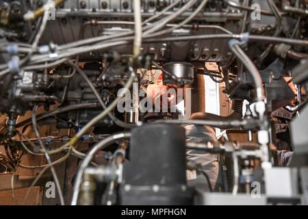 170303-N-RM689-214  SOUTH CHINA SEA (March 3, 2017) Gas Turbine System Technician 2nd Class Andrew Mesenbrink, from Killen, Alabama, holds training on gas turbine generators during a tour of an engine room aboard Arleigh Burke-class guided-missile destroyer USS Wayne E. Meyer (DDG 108). Wayne E. Meyer is on a regularly scheduled Western Pacific deployment with the Carl Vinson Carrier Strike Group as part of the U.S. Pacific Fleet-led initiative to extend the command and control functions of U.S. 3rd Fleet into the Indo-Asia-Pacific region. U.S. Navy aircraft carrier strike groups have patrolle Stock Photo