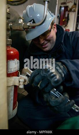 170306-N-VB241-0020 BREMERTON, Washington (March 6, 2017) Damage Controlman 3rd Class Cody Abbott, from Lindstrom, Minnesota, removes an aqueous potassium carbonate bottle from the mess decks as part of galley upgrades aboard USS John C. Stennis (CVN 74). John C. Stennis is conducting a planned incremental availability (PIA) at Puget Sound Naval Shipyard and Intermediate Maintenance Facility, during which the ship is undergoing scheduled maintenance and upgrades. (U.S. Navy photo by Mass Communication Specialist 3rd Class Zachary C. Wolfe / Released) Stock Photo