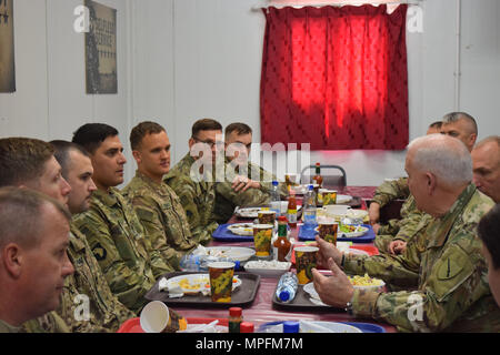 Kentucky's Director of the Joint Staff Brig. Gen. Benjamin Adams III, right, talks with Soldiers of the 149th Military Engagement team Mar. 3 during a visit to Camp Arifjan, Kuwait. Stock Photo