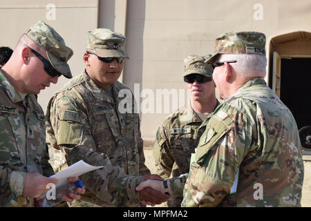 Kentucky's Director of the Joint Staff Brig. Gen. Benjamin Adams III greets Soldiers from the 207th Horizontal Construction Company Mar. 4 during a visit to Camp Arifjan, Kuwait. Stock Photo