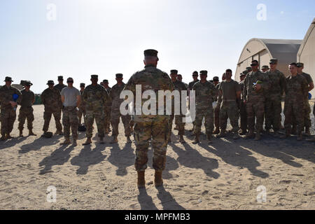 Brig. Gen. Benjamin Adams III, Kentucky's Director of the Joint Staff, speaks to the Soldiers of the 207th Horizontal Construction Company, during his visit Mar. 4 to Camp Arifjan, Kuwait. Stock Photo