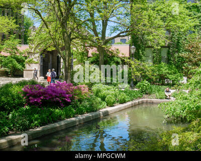 Chicago, Illinois, USA.  23rd May 2018. After a generally chilly spring,  students and staff enjoy a warm sunny day on the picturesque campus of the University of Chicago. Unfortunately, temperatures are expected to rise to near  90ºF/32ºC by the weekend. Credit: Todd Bannor/Alamy Live News Stock Photo