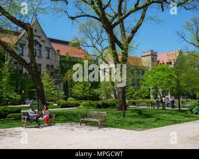Chicago, Illinois, USA.  23rd May 2018. After a generally chilly spring,  students and staff enjoy a warm sunny day on the picturesque campus of the University of Chicago. Unfortunately, temperatures are expected to rise to near  90ºF/32ºC by the weekend. Credit: Todd Bannor/Alamy Live News Stock Photo
