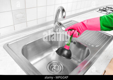 Rubber pump for cleaning the sink. Stock Photo