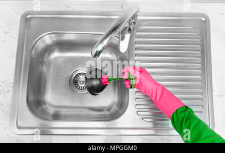 Rubber pump for cleaning the sink. Stock Photo