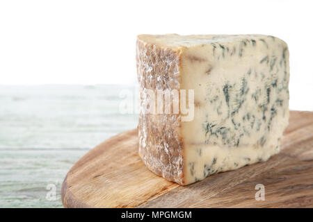 Wedge of Stilton Cheese on a Cheeseboard Stock Photo