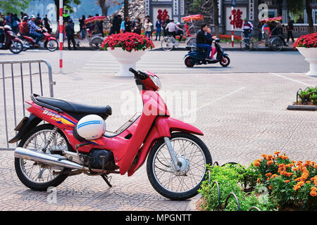 Hanoi, Vietnam - February 21, 2016: Scooter on busy street in Hanoi, Vietnam Stock Photo