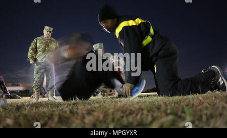 Spc. Cameron Stanko, Northeast Medical Area Readiness Support Group, turns to a blur while knocking out situps during the Army Physical Fitness Test that kicked off the Best Warrior Competition at Camp Bullis, Texas, 9 Feb.  U.S. Army Reserve Soldiers from the Medical Readiness and Training Command, Northeast MARSG, Southeast MARSG, Central MARSG and Western MARSG competed in the Best Warrior Competition for their respective commands in a combined competition 8-12 Feb., 2017. (Photo by Sgt. 1st Class Tony M. Lindback, MRTC Public Affairs.) Stock Photo