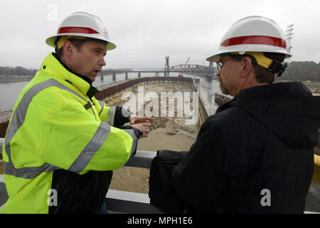 Tommy Long (Left), resident engineer for the Chickamauga Lock Replacement Project, explains how the river bed will be excavated ahead of future construction of the new 110-foot by 600-foot navigation lock to Douglas Lamont, senior official performing duties of secretary of the Army for Civil Works, during his visit to the lock on the Tennessee River in Chattanooga, Tenn., Feb. 28, 2017. (USACE photo by Leon Roberts) Stock Photo