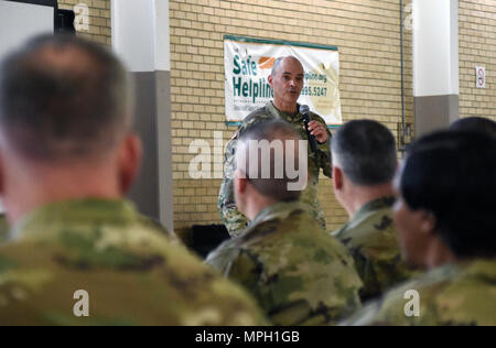 U.S. Army Col. Matthew Fryman, human resources director, speaks to the crowd of more than 150 Soldiers, Airmen, and civilians gathered at the Bluff Road armory in Columbia, South Carolina for a Town Hall meeting Mar. 1, 2017, to address concerns and discuss the way ahead for the South Carolina Military Department. (U.S. Army National Guard photo by Capt. Jessica Donnelly) Stock Photo