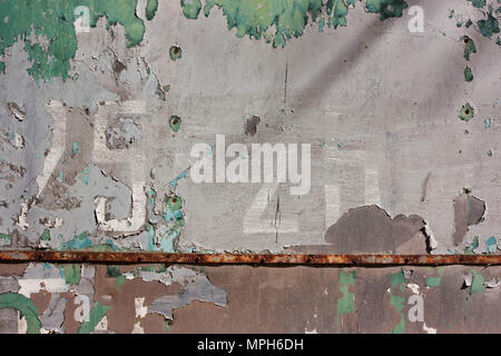 Grunge background with peeling gray and green paint, with rust Stock Photo