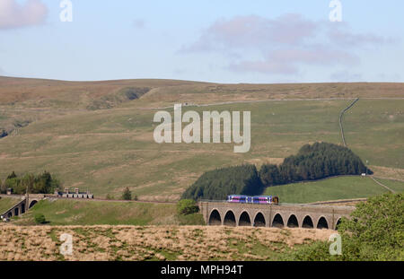Class 158 Express Sprinter dmu with a passenger train on the Settle to Carlisle Railway line crossing Dandry Mire viaduct on approach to Garsdale. Stock Photo
