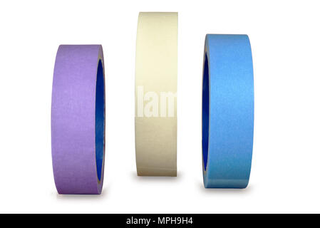 Three different color rolls of painting or masking paper tape,  isolated on white background, with clipping path. Stock Photo