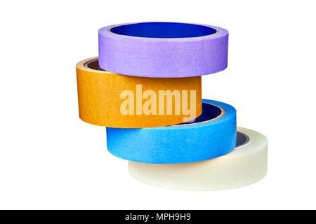 Four multi-colored duct tape or adhesive tapes are stacked one above the other on table, isolated on white background, with clipping path. Stock Photo