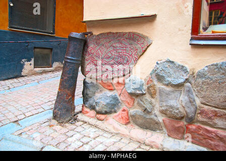 STOCKHOLM, SWEDEN - APRIL 11, 2010: Runestone in Gamla Stan. This runes presumably from Iron Age period. Stock Photo