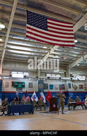 Sgt. Maj. of the Army (Ret.) Kenneth Preston, speaks during the Troops First Foundation’s Operation Proper Exit Hero’s Town Hall in the Area Support Group - Kuwait Morale Warfare Recreation gym in Camp Arifjan, Kuwait, on Mar. 14, 2017. (U.S. Army photo by Staff Sgt. Dalton Smith) Stock Photo