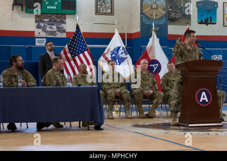 Master Sgt. (Ret.) Leroy Petry, with Troops First Foundation’s Operation Proper Exit, also a recipient of the Medal of Honor, speaks during a Hero’s Town Hall in the Area Support Group - Kuwait Morale Warfare Recreation gym in Camp Arifjan, Kuwait, on Mar. 14, 2017. (U.S. Army photo by Staff Sgt. Dalton Smith) Stock Photo