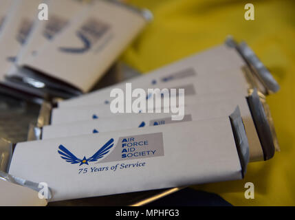 Mementos sit on display during the Air Force Aid Society 75th Anniversary Celebration at the Sablich Center March 10, 2017, on Keesler Air Force Base, Miss. Gen. Henry ‘Hap’ Arnold founded the relief organization in 1942, which is the official charity of the U.S. Air Force and exists to meet the unique needs of Total Force Airmen, their families and widows or widowers. (U.S. Air Force photo by Kemberly Groue) Stock Photo