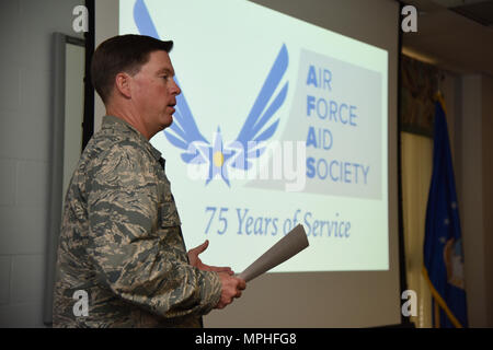 Col. C. Mike Smith, 81st Training Wing vice commander, delivers remarks during the Air Force Aid Society 75th Anniversary Celebration at the Sablich Center March 10, 2017, on Keesler Air Force Base, Miss. Gen. Henry ‘Hap’ Arnold founded the relief organization in 1942, which is the official charity of the U.S. Air Force and exists to meet the unique needs of Total Force Airmen, their families and widows or widowers. (U.S. Air Force photo by Kemberly Groue) Stock Photo