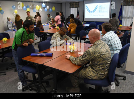 Keesler personnel attend the Air Force Aid Society 75th Anniversary Celebration at the Sablich Center March 10, 2017, on Keesler Air Force Base, Miss. Gen. Henry ‘Hap’ Arnold founded the relief organization in 1942, which is the official charity of the U.S. Air Force and exists to meet the unique needs of Total Force Airmen, their families and widows or widowers. (U.S. Air Force photo by Kemberly Groue) Stock Photo