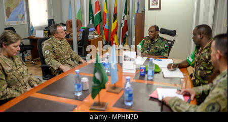 U.S. Air Force Brig. Gen. Phil Purcell, Combined Joint Task Force-Horn of Africa (CJTF-HOA) deputy commander, discusses the current status of Somalia with Djibouti Armed Forces Lt. Gen. Osman Noor Soubagleh, force commander of the African Union Mission in Somalia (AMISOM), and other key members of AMISOM, in Mogadishu, Somalia March 15, 2017.  The meeting helped to coordinate CJTF-HOA, the United Nations, European Union, the AMISOM and other international partner’s efforts to stabilize Somalia and the surrounding regions. (U.S. Air National Guard photo by Staff Sgt. Christian M. Jadot) Stock Photo