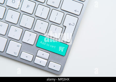 Add to cart button on computer keyboard with shopping cart Stock Photo