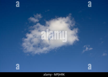 ackground of fluffy white cumulus cloud an a clear blue sky Stock Photo