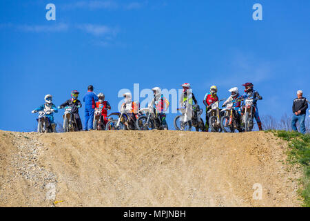 extreme riders stand on the mountain before the start of the competition Stock Photo