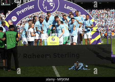 The Premier League trophy takes a tumble as Manchester City's Alexander Zinchenko (centre) and Kyle Walker (centre right) look on with team-mates Stock Photo