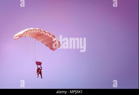 Cpl. Alex Thill parachutes through a red smoke grenade March 16, 2017 during parachute operations with the Republic of Korea Marine Corps at Josari drop zone, Republic of Korea, in support of Korea Marine Exercise Program 17-6. While each KMEP iteration is unique to the units involved and the training goals, all iterations are designed to increase the combined readiness. Thill, a Mitchell, South Dakota native, is an assistant radio operator with 3d Reconnaissance Battalion, 3rd Marine Division, III Marine Expeditionary Force. (U.S. Marine Corps photo by Sgt. Ally Beiswanger) Stock Photo