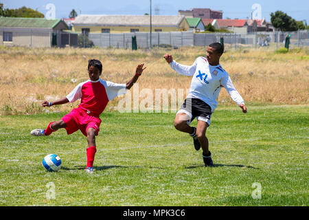 Cape Town, South Africa, December 06, 2011, Diverse children playing soccer football at school Stock Photo