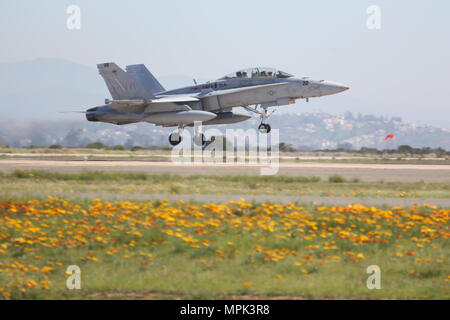 An F/A-18 Hornet with Marine Fighter Attack Squadron (VMFA) 314 takes off en route to a simulated dog fight against the Air Force’s F-16 Falcons with the 310th Fighter Squadron at Marine Corps Air Station Miramar, Calif., March 16. The two squadrons are training their pilots in basic fighting maneuvers from March 16 to March 24 at MCAS Miramar. Stock Photo