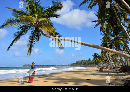 Happy tourist on the Limon beach wild and hard to reach on the south coast of Dominican Republic Stock Photo