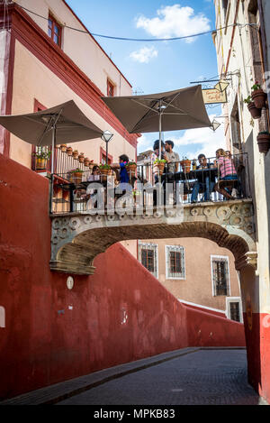 Calle de Campanero, street with a bridge with a cafe over it, Guanajuato, city in Central Mexico Stock Photo