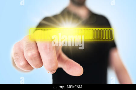 man touching yellow glowing progress bar on translucent touch screen interface Stock Photo