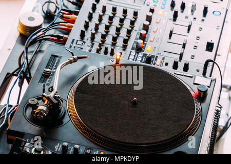 DJ Equipment Deck With Music Track Control And Mixer At Club Night Party Stock Photo