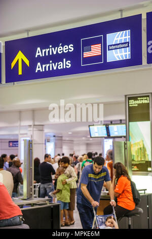 Montreal Canada,Quebec Province,Trudeau International Airport,sign,logo,arrivals,French,passenger passengers rider riders,visitors travel traveling to Stock Photo