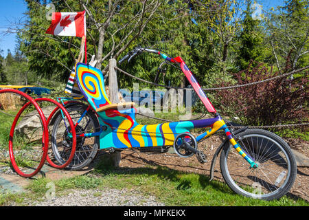 Abstract painted recumbent bicycle, Hornby Island, BC, Canada Stock Photo