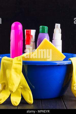 Cleaning items in bucket isolated on black Stock Photo