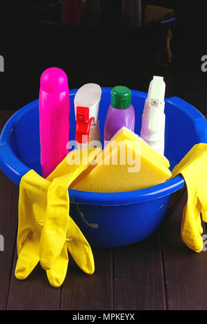 Cleaning items in bucket isolated on black Stock Photo