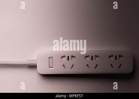 socket and plug electric power bar white color. save energy and reduce energy efficiency concept - underexposure filter Stock Photo