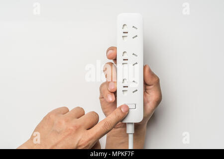 hand switch on/off socket plug electric power bar white color isolate. save energy and reduce energy efficiency concept Stock Photo