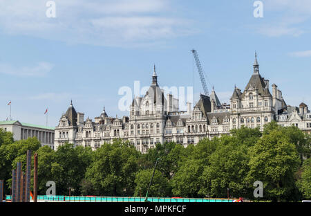 One Whitehall Place behind Thames Tideway Tunnel works on Victoria Embankment Foreshore, London SW1, seen from the River Thames South Bank Stock Photo