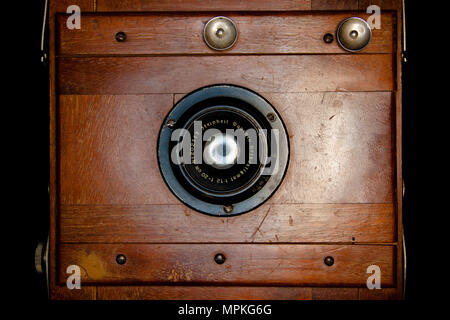 Frontal vintage rare wooden camera projecting light from the inside Stock Photo